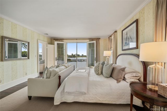 a bedroom with a bed a couch and dresser