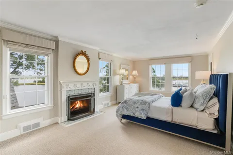 a bedroom with a bed and a fireplace