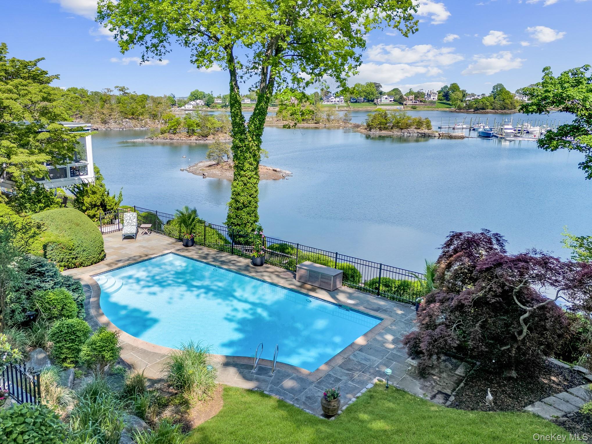13 Kirby Lane Rye, NY 10580 - Photo 25 of 34 an aerial view of a house with a yard and lake view