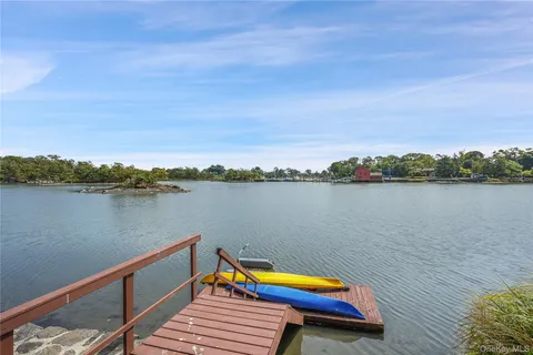 a view of a grassy field with trees