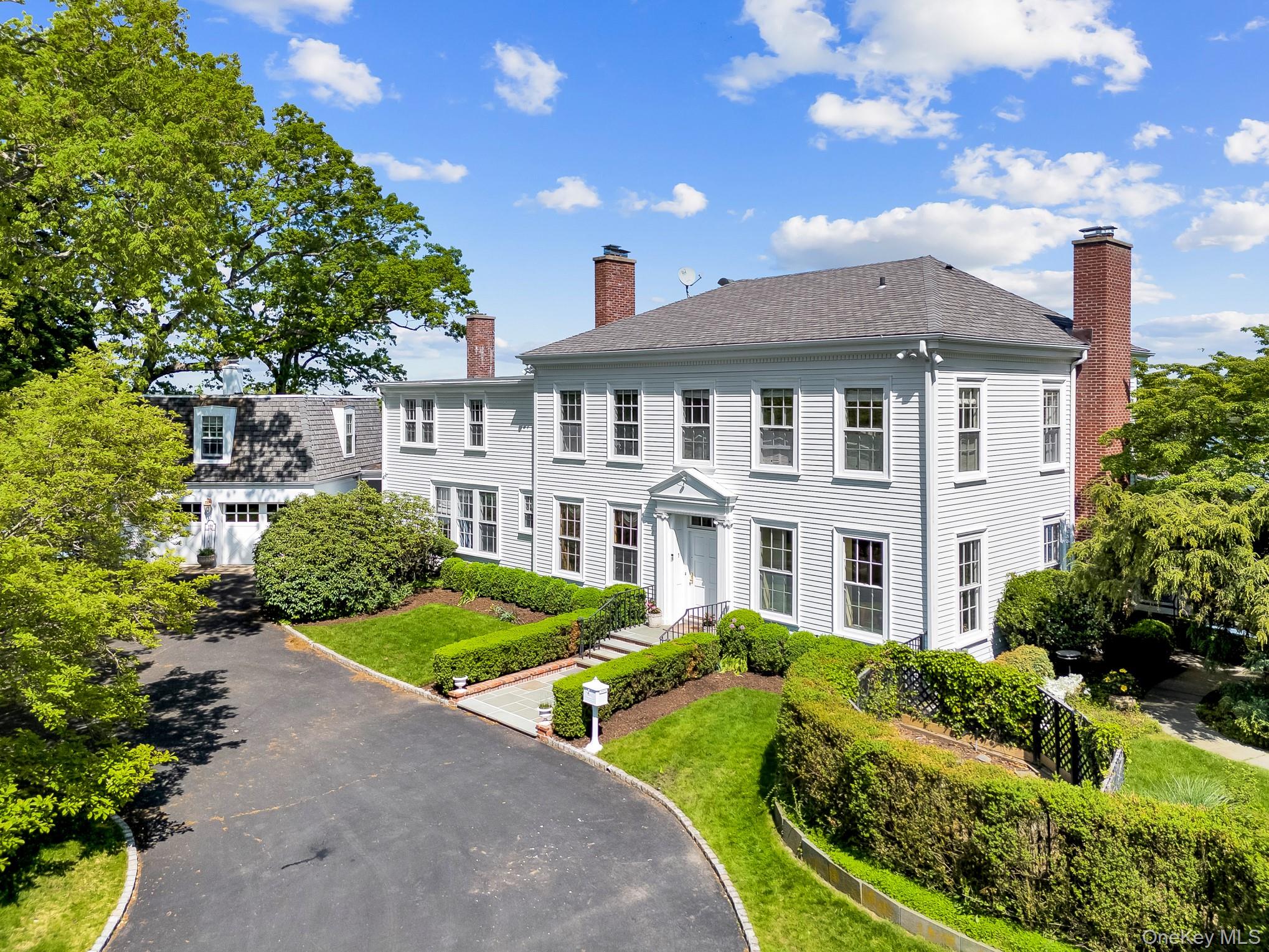 13 Kirby Lane Rye, NY 10580 - Photo 3 of 34 a front view of a house with a yard