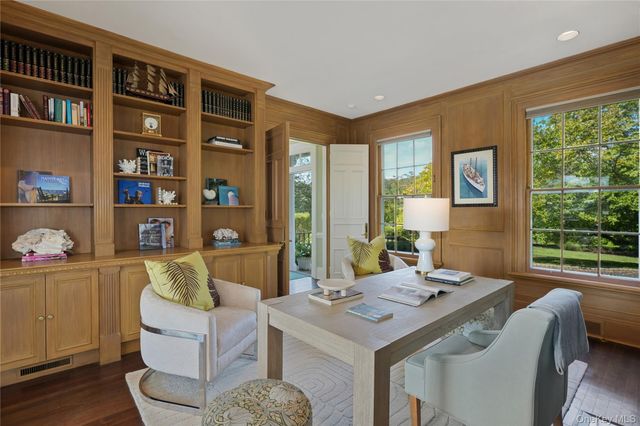 a view of a livingroom with furniture and window