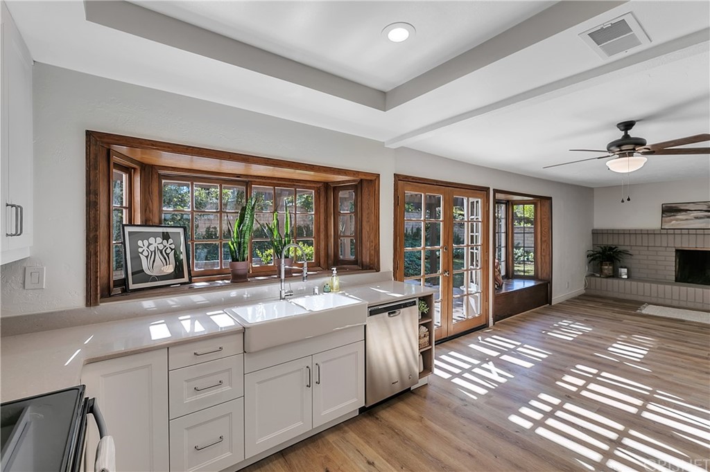 23646 Vía Corsa Valencia, CA 91355 - Photo 11 of 55 a large living room with stainless steel appliances granite countertop furniture and a large window