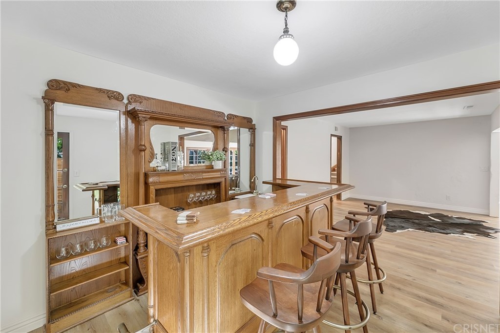 23646 Vía Corsa Valencia, CA 91355 - Photo 22 of 55 a living room with a table and chairs