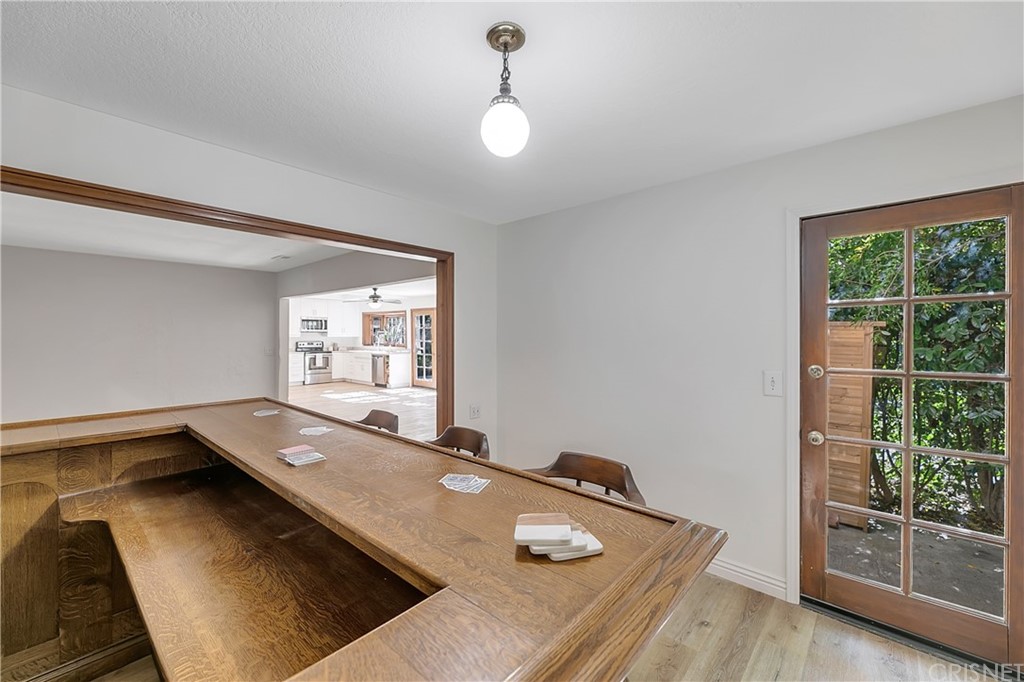 23646 Vía Corsa Valencia, CA 91355 - Photo 23 of 55 a view of a room with a large window and wooden floor