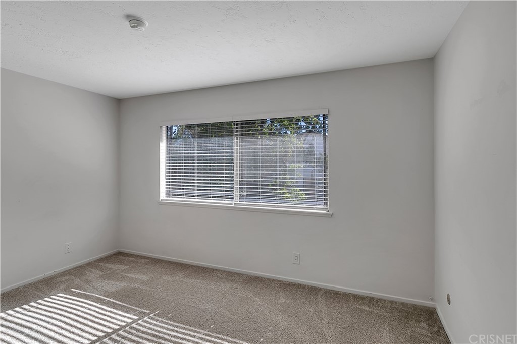 23646 Vía Corsa Valencia, CA 91355 - Photo 31 of 55 a view of an empty room with a window