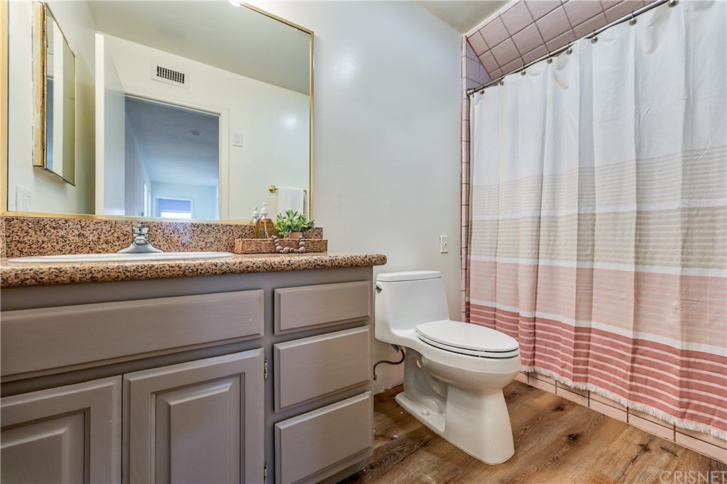 23646 Vía Corsa Valencia, CA 91355 - Photo 35 of 55 a bathroom with a sink and a toilet