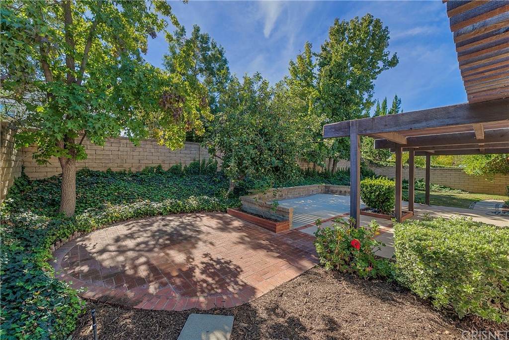 23646 Vía Corsa Valencia, CA 91355 - Photo 40 of 55 a view of a backyard with wooden fence