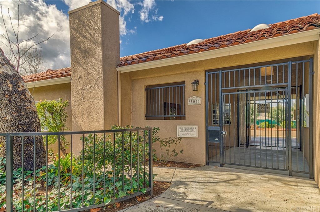23646 Vía Corsa Valencia, CA 91355 - Photo 45 of 55 a view of a house with a small yard and wooden floor and fence
