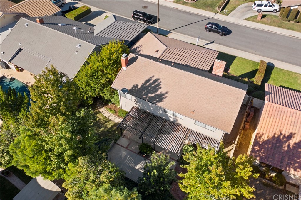 23646 Vía Corsa Valencia, CA 91355 - Photo 52 of 55 an aerial view of a house with a yard and potted plants