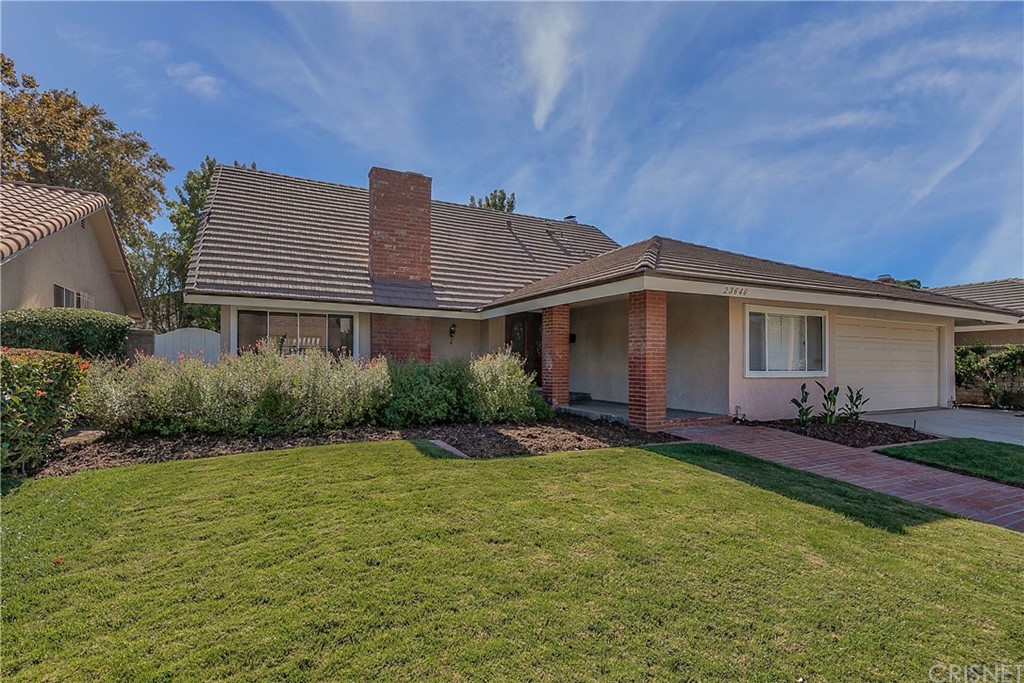 23646 Vía Corsa Valencia, CA 91355 - Photo 54 of 55 a view of a house with a yard and plants