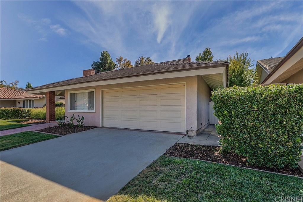 23646 Vía Corsa Valencia, CA 91355 - Photo 55 of 55 front view of a house with a yard