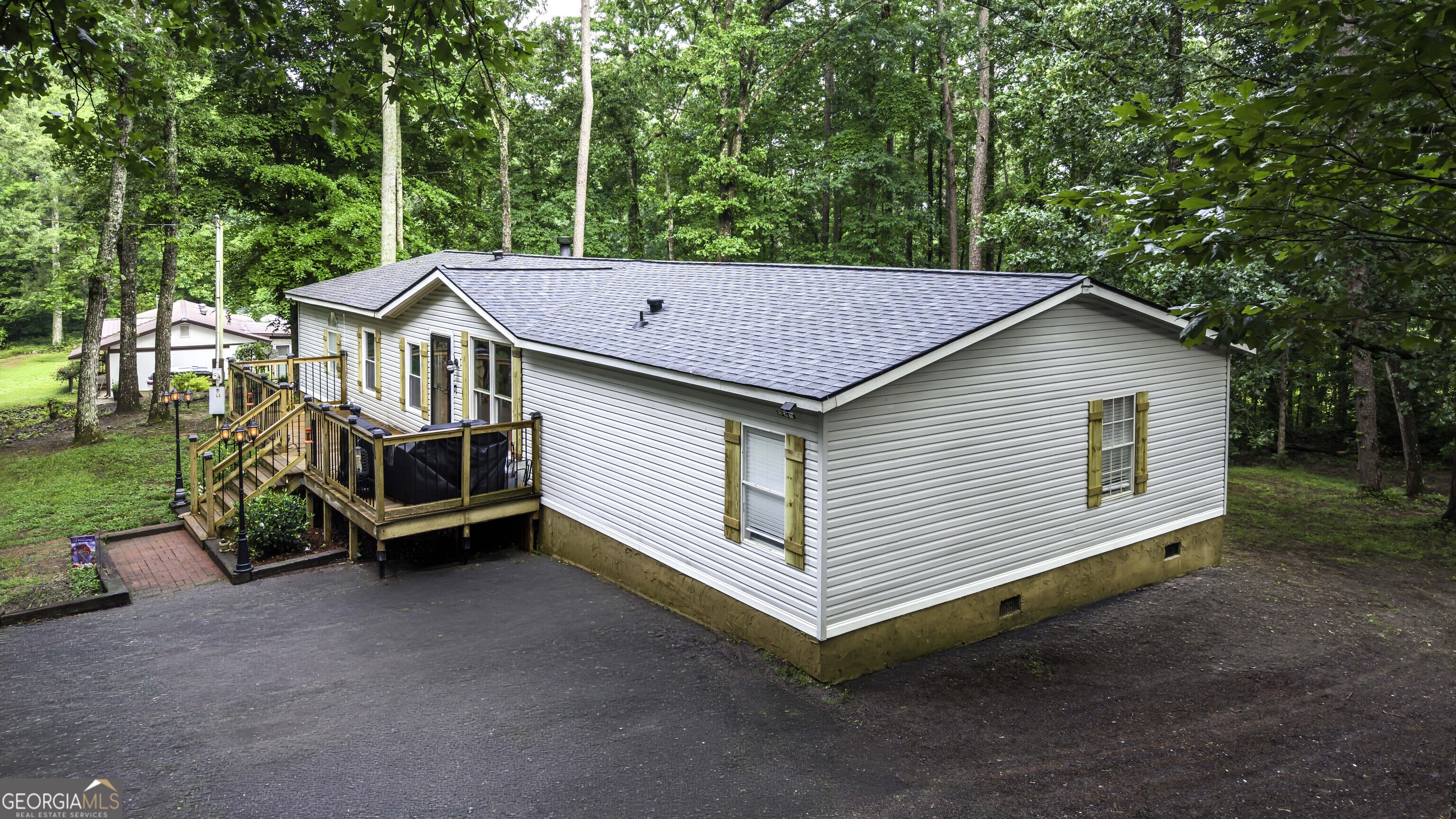 91 Holder Road Temple, GA 30179 - Photo 3 of 40 a view of a house with a yard and large trees