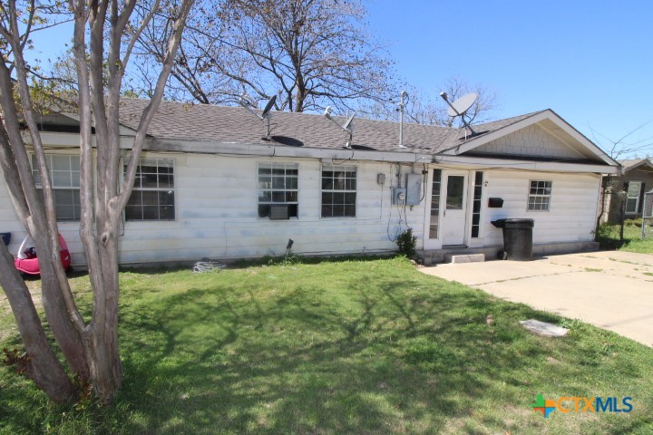 714 South 20th Street, Unit B Temple, TX 76501 - Photo 1 of 1 a front view of a house with a yard and garage