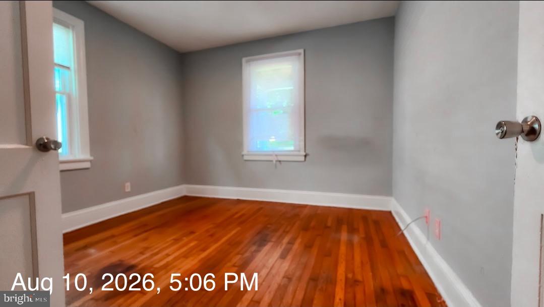 3900 Decatur Street Richmond, VA 23224 - Photo 6 of 19 Bright, airy room with hardwood floors.
