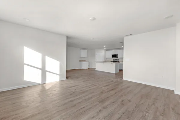 a view of a kitchen with a sink and a window