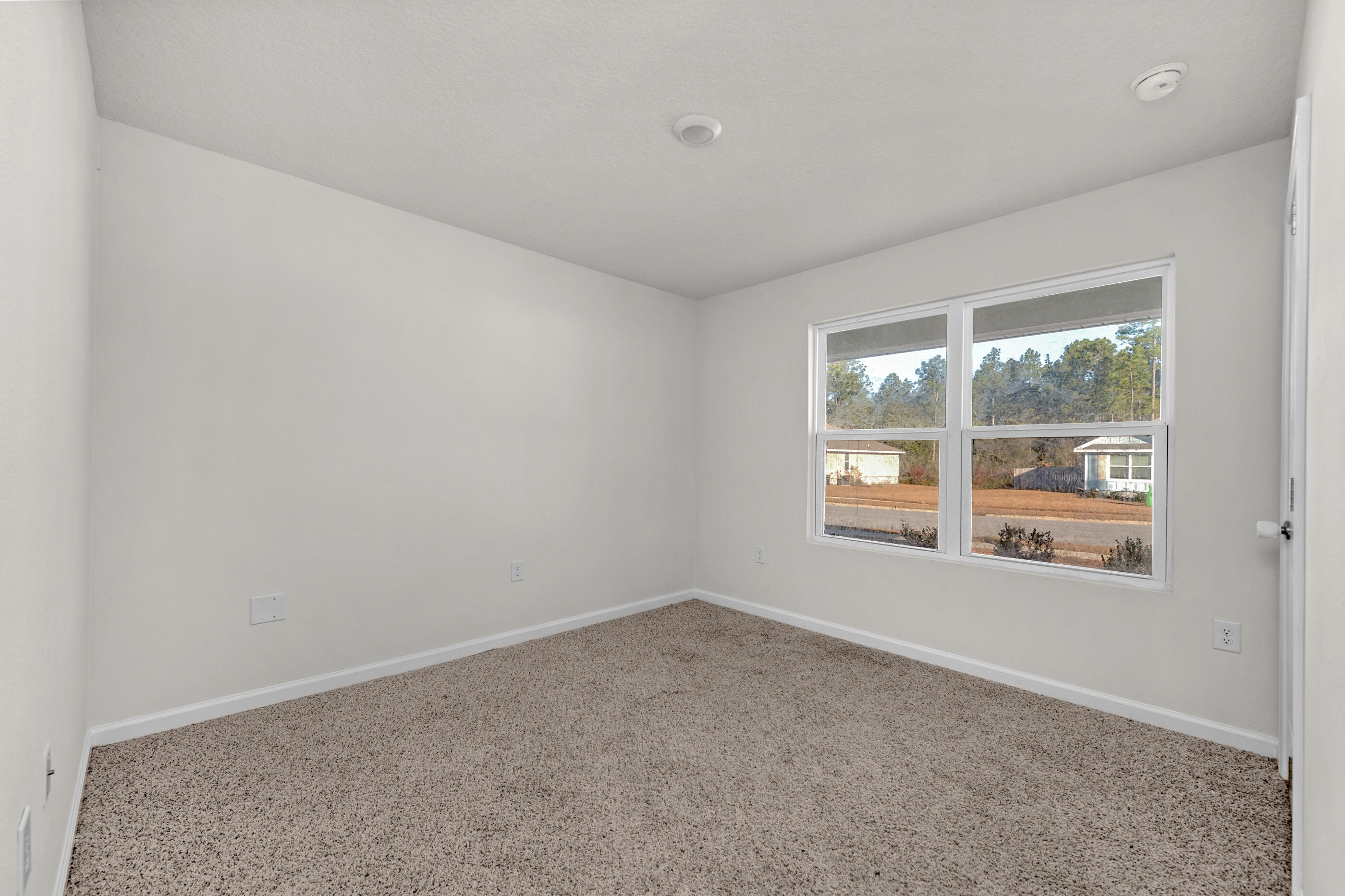 3524 Sugar Maple Lane Crestview, FL 32539 - Photo 19 of 24 an empty room with windows