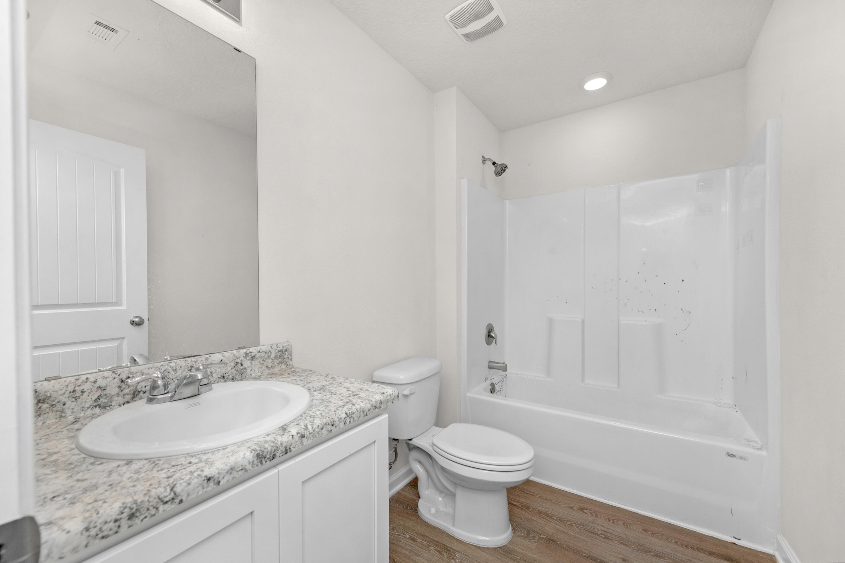 3524 Sugar Maple Lane Crestview, FL 32539 - Photo 20 of 24 a bathroom with a granite countertop sink toilet and shower