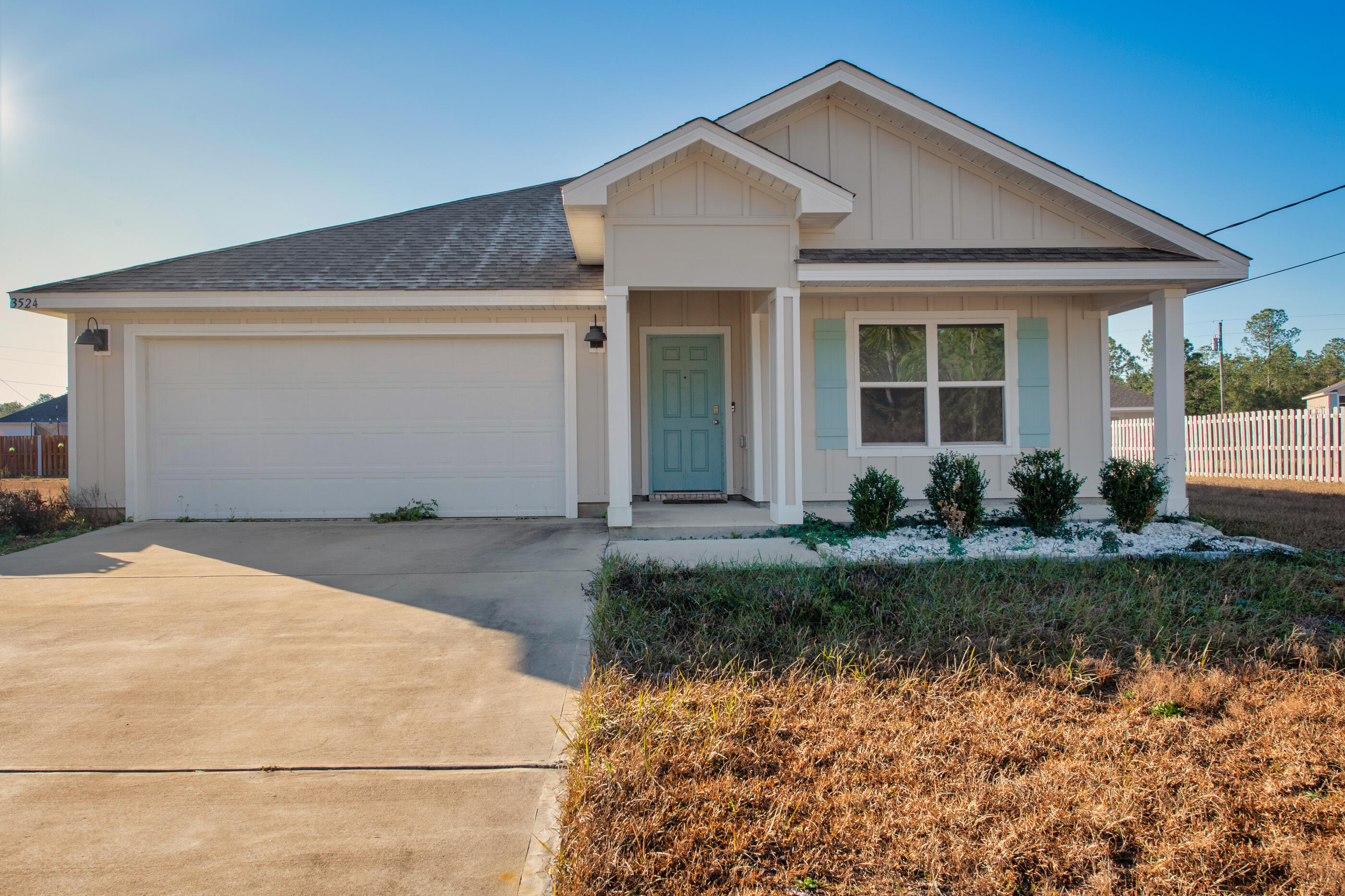 3524 Sugar Maple Lane Crestview, FL 32539 - Photo 3 of 24 a front view of a house with garden