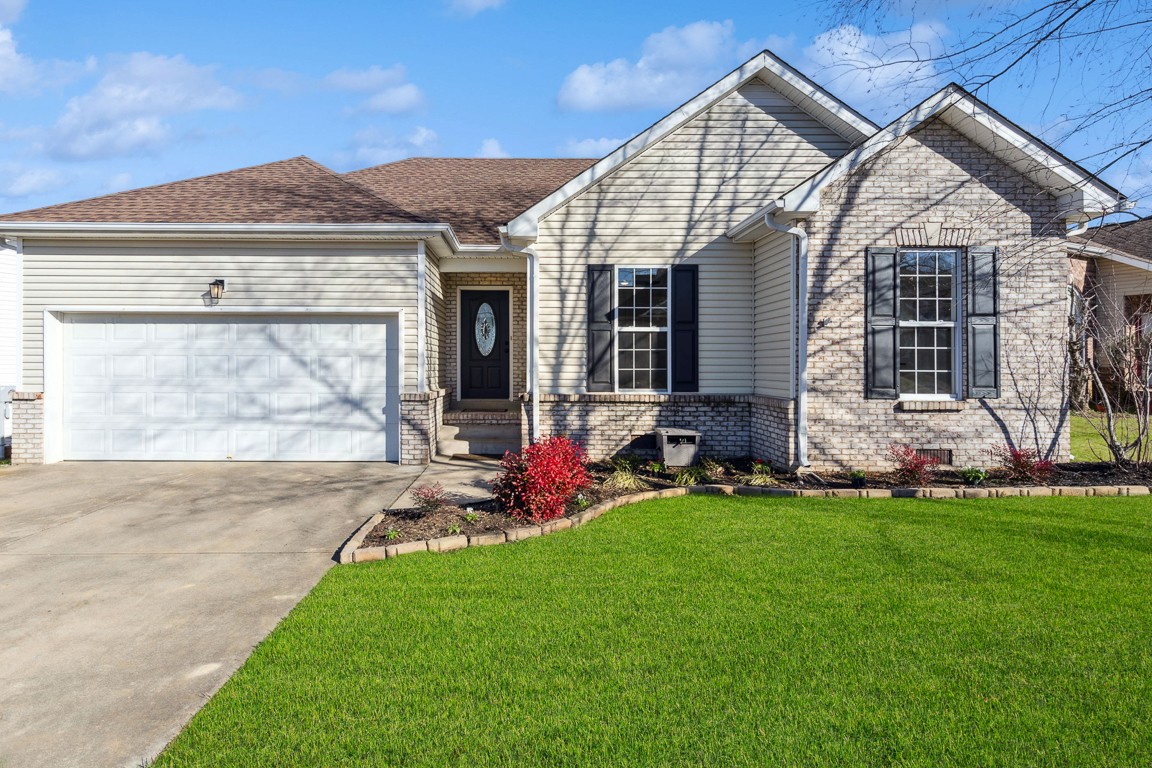 a view of a house with a backyard