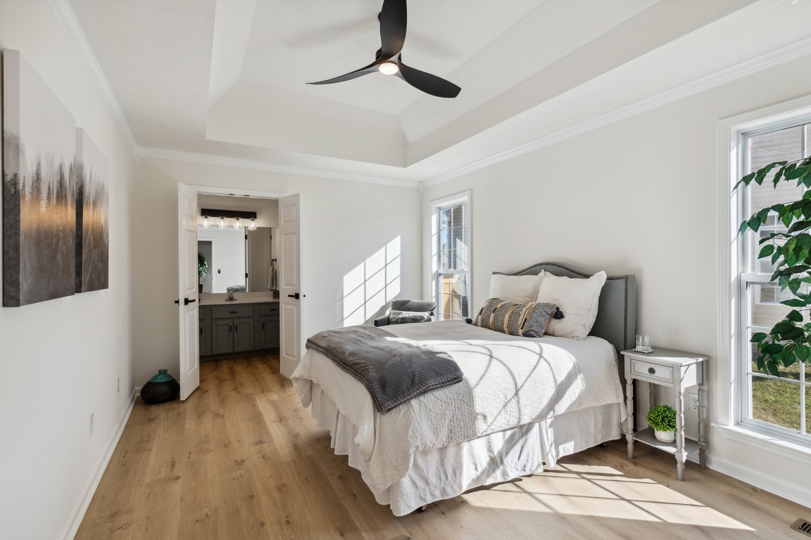 486 Berry Circle Springfield, TN 37172 - Photo 13 of 27 a bedroom with a bed and a chandelier