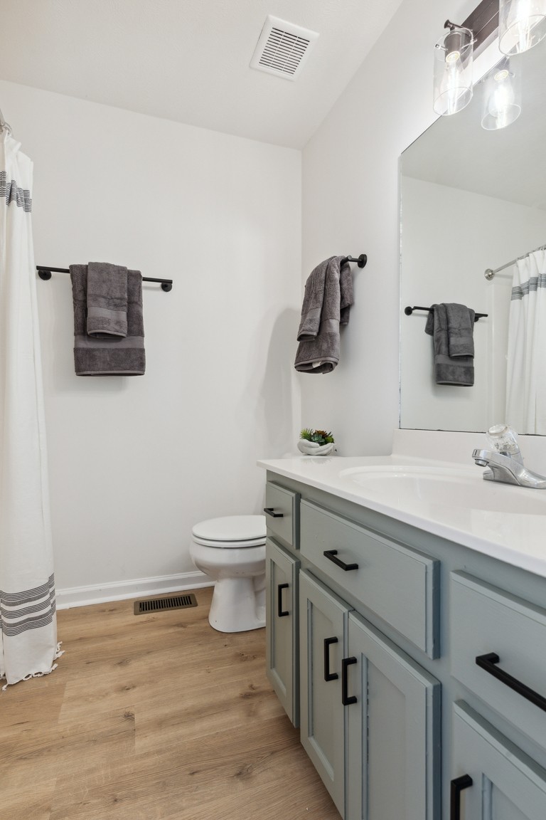 486 Berry Circle Springfield, TN 37172 - Photo 21 of 27 a bathroom with a sink a toilet and mirror