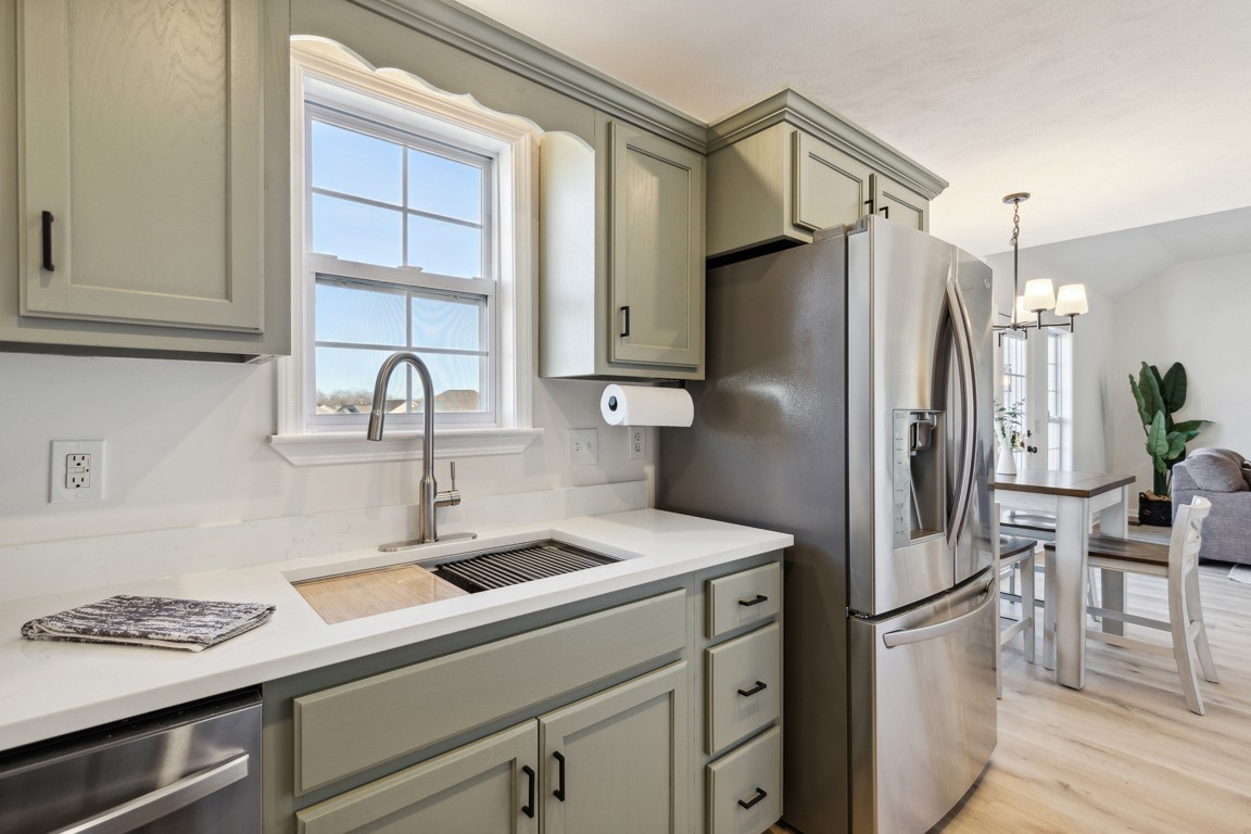 486 Berry Circle Springfield, TN 37172 - Photo 10 of 27 a kitchen with stainless steel appliances a refrigerator and a sink