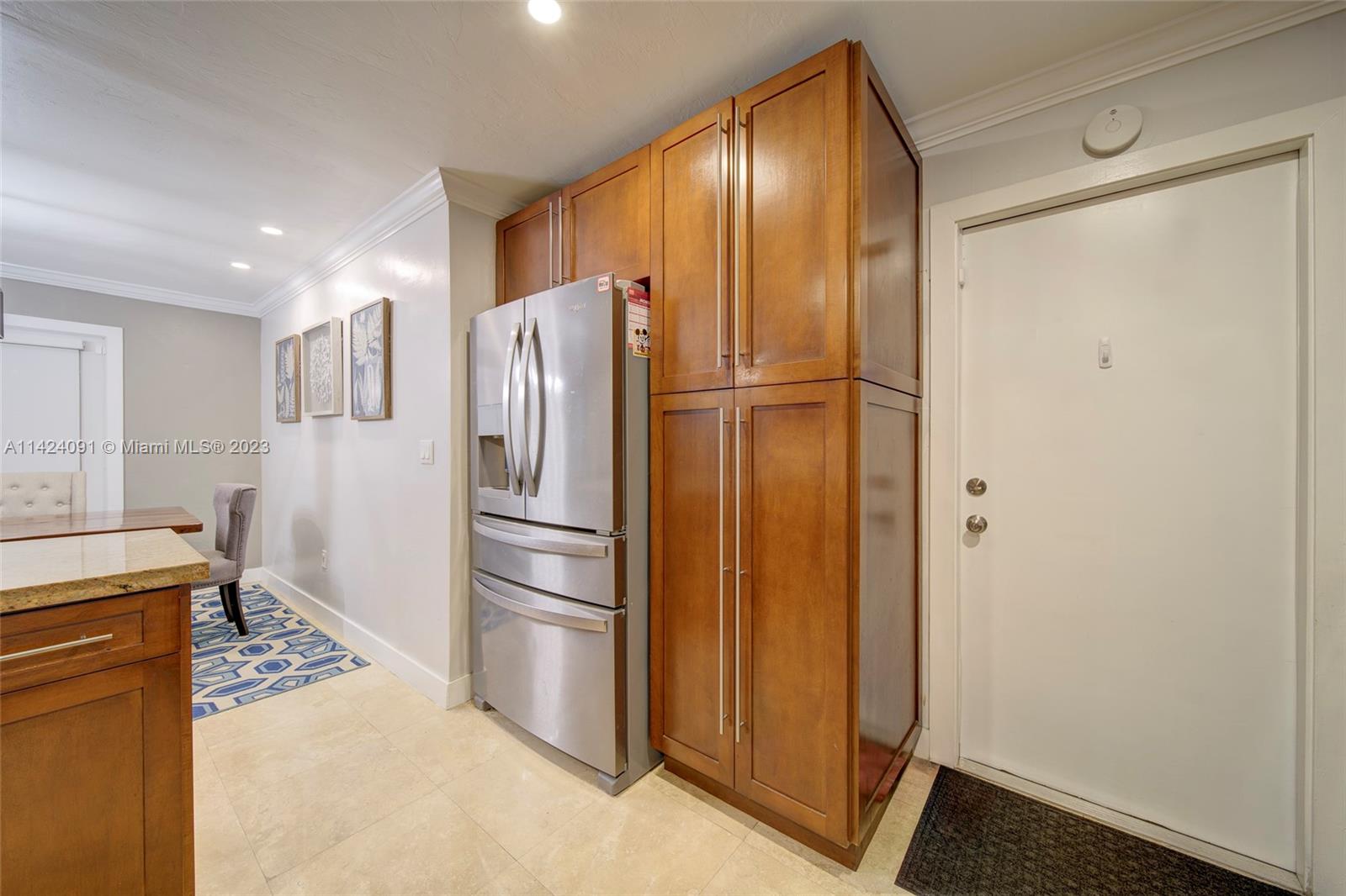 10600 Southwest 108th Terrace Miami, FL 33176 - Photo 18 of 43 a kitchen with stainless steel appliances a refrigerator and a stove top oven