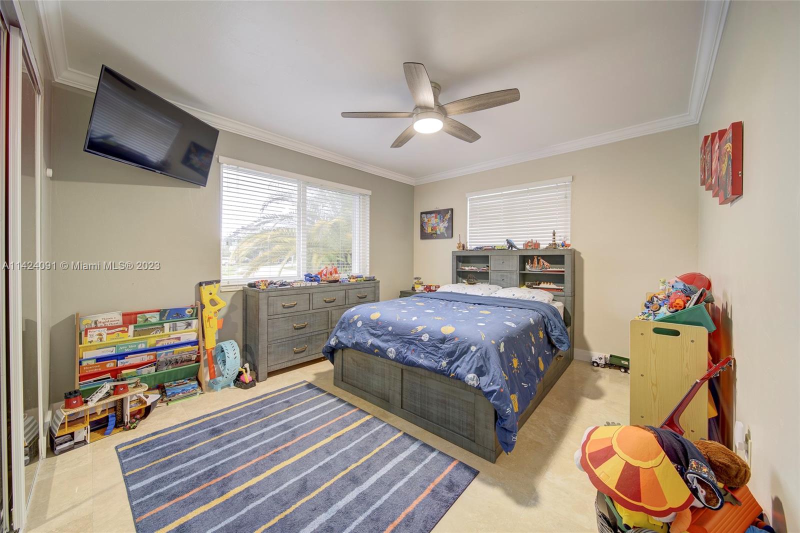 10600 Southwest 108th Terrace Miami, FL 33176 - Photo 23 of 43 a bedroom with a bed and a tv on the dresser