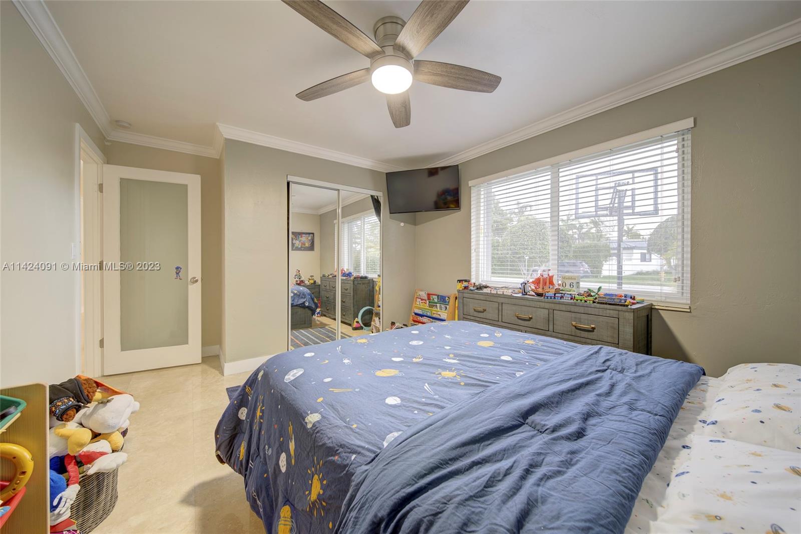 10600 Southwest 108th Terrace Miami, FL 33176 - Photo 24 of 43 a bedroom with a bed and a chandelier