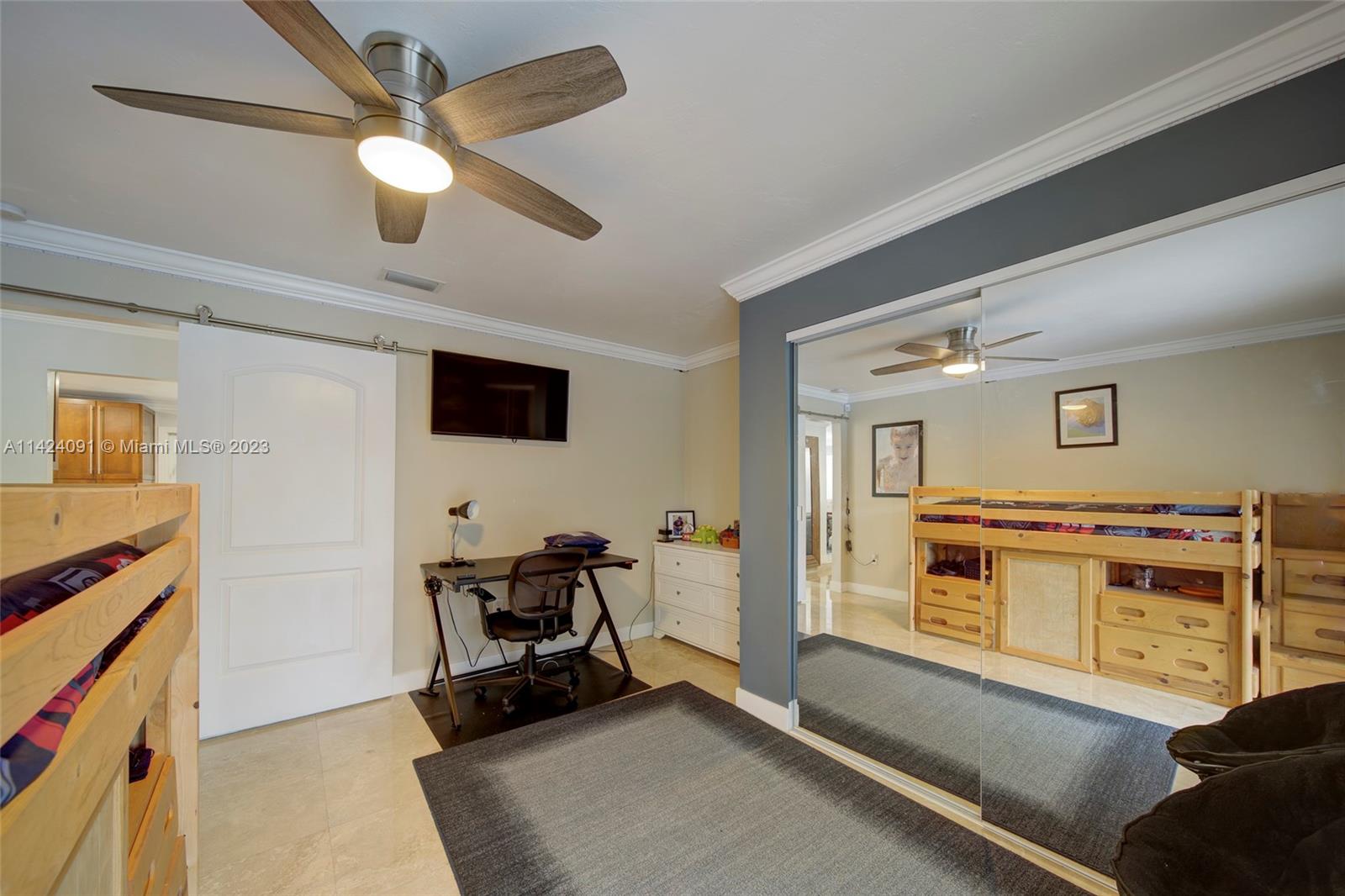 10600 Southwest 108th Terrace Miami, FL 33176 - Photo 26 of 43 a living room with furniture and a flat screen tv