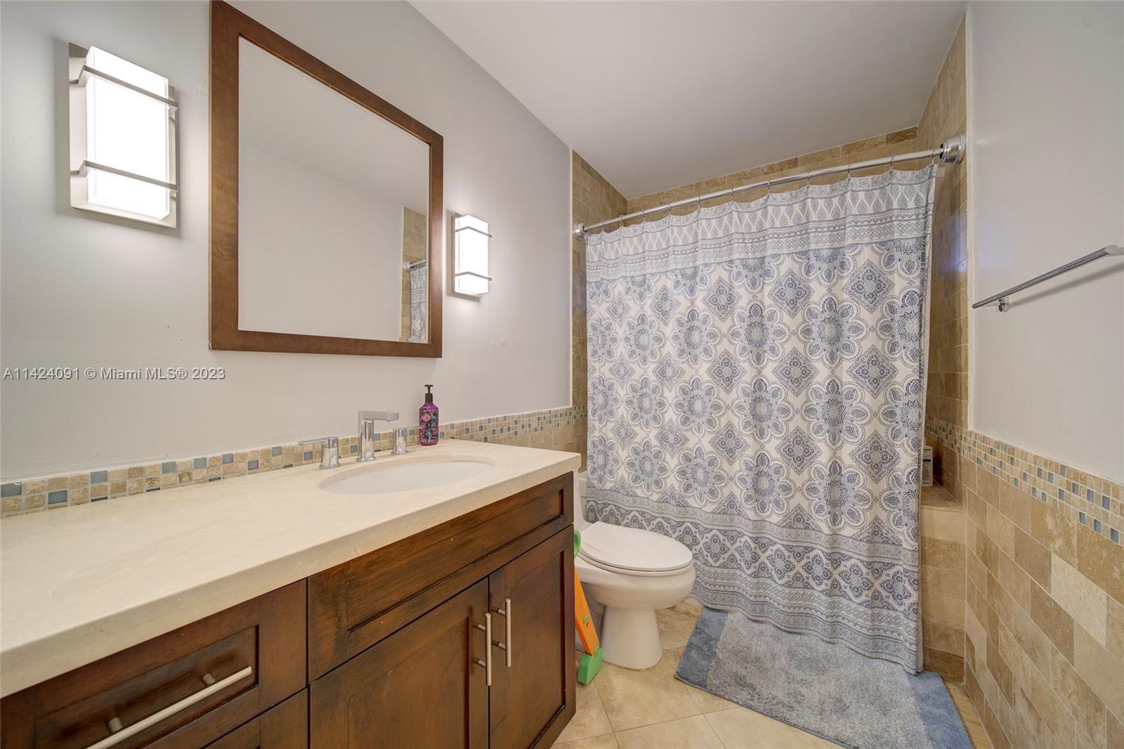 10600 Southwest 108th Terrace Miami, FL 33176 - Photo 29 of 43 a bathroom with a sink a toilet and a mirror