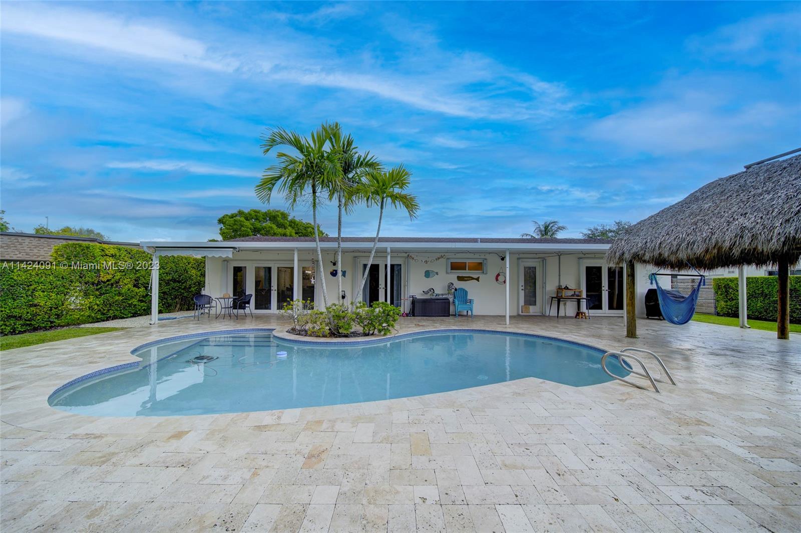 10600 Southwest 108th Terrace Miami, FL 33176 - Photo 30 of 43 a view of a house with pool and sitting area