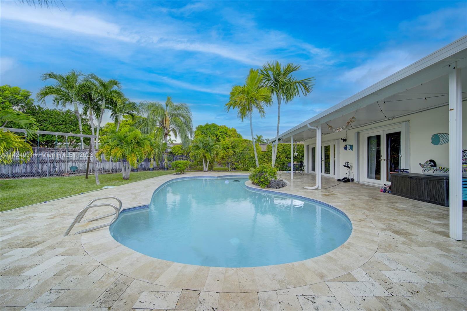 10600 Southwest 108th Terrace Miami, FL 33176 - Photo 33 of 43 a view of a house with swimming pool and a yard