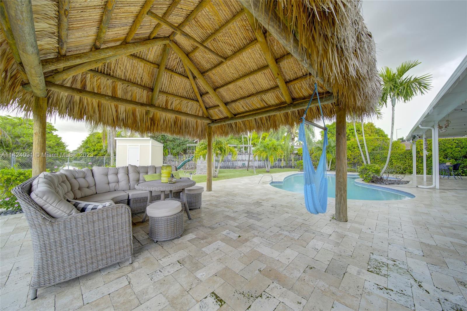 10600 Southwest 108th Terrace Miami, FL 33176 - Photo 37 of 43 a view of a patio with a table and chairs