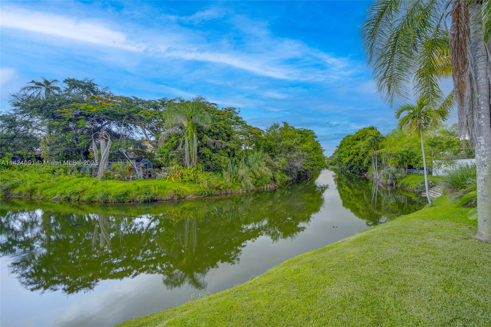 10600 Southwest 108th Terrace Miami, FL 33176 - Photo 42 of 43 a view of a lake with a yard