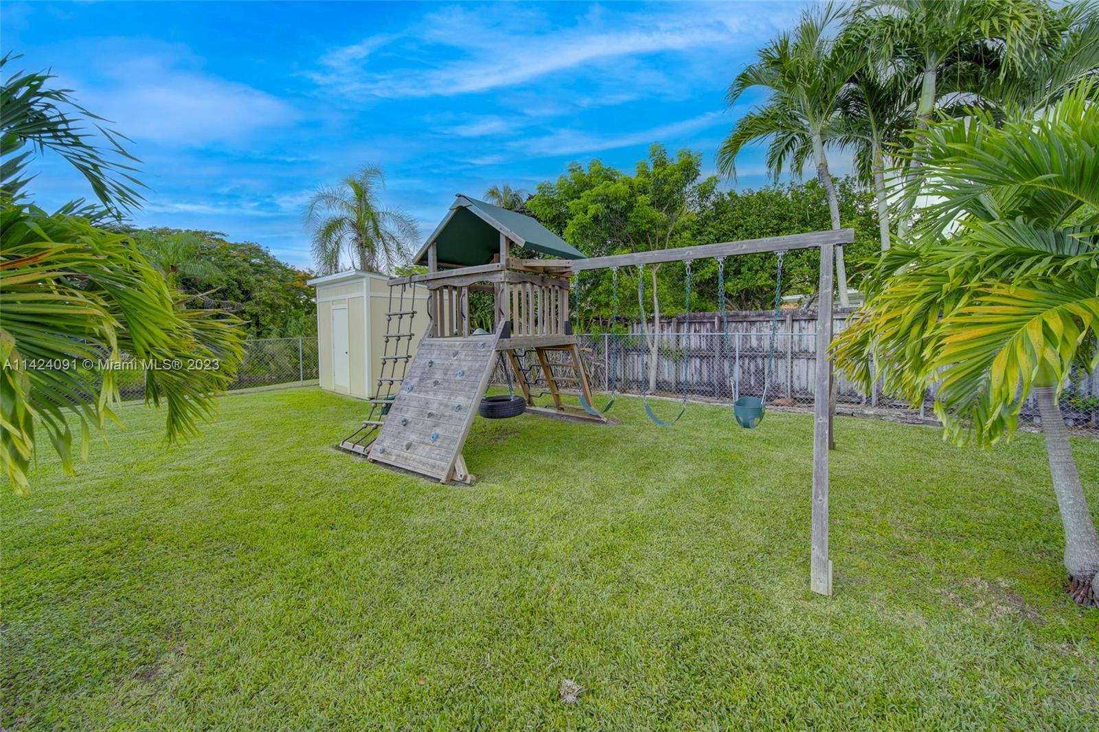 10600 Southwest 108th Terrace Miami, FL 33176 - Photo 43 of 43 a view of a house with a yard and sitting area