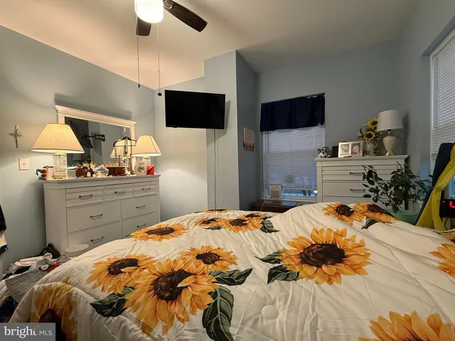 a bed room with a bed and a television