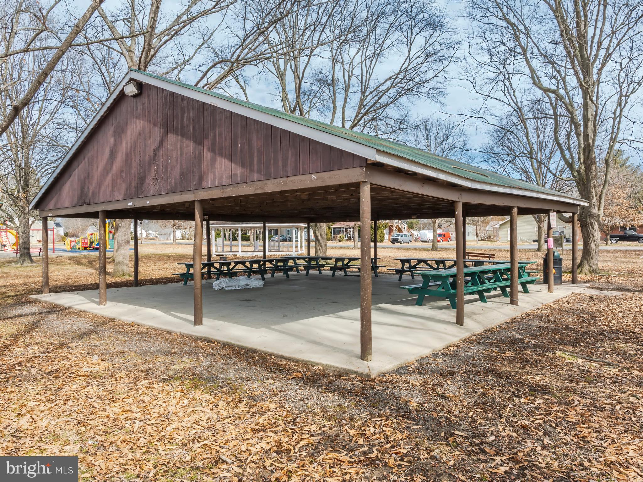 504 Central Avenue Ridgely, MD 21660 - Photo 35 of 38 a patio with a table and chairs under an umbrella