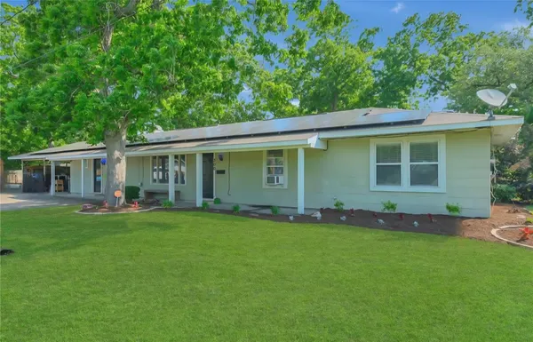 front view of a house with a garden