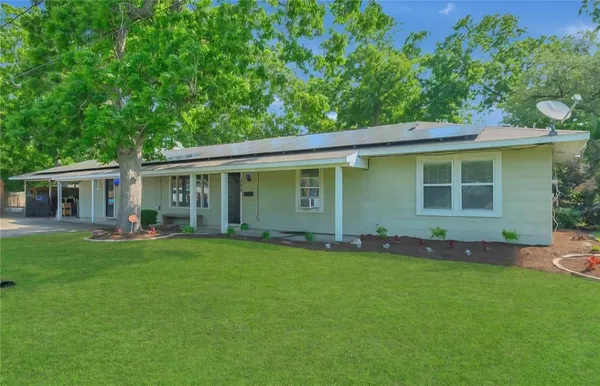 front view of a house with a garden