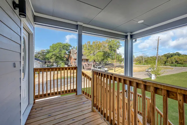 a view of a porch with wooden floor and outdoor space