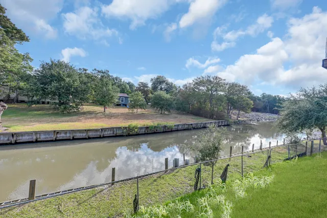 a view of a lake with a yard