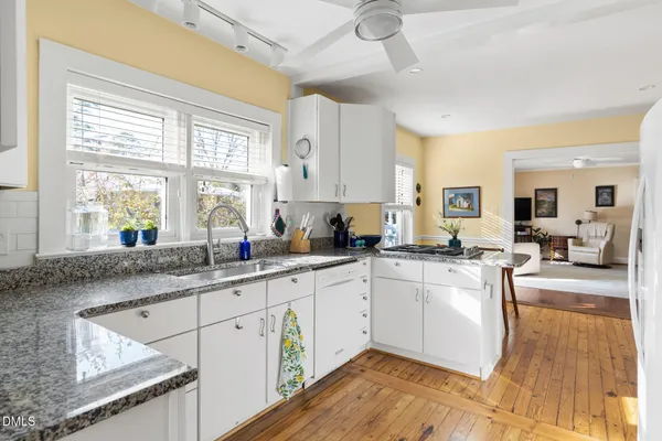 a kitchen with a sink and a window