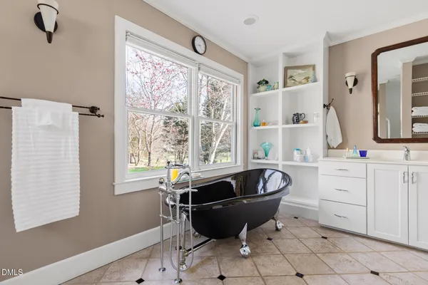 a living room with a table and chair