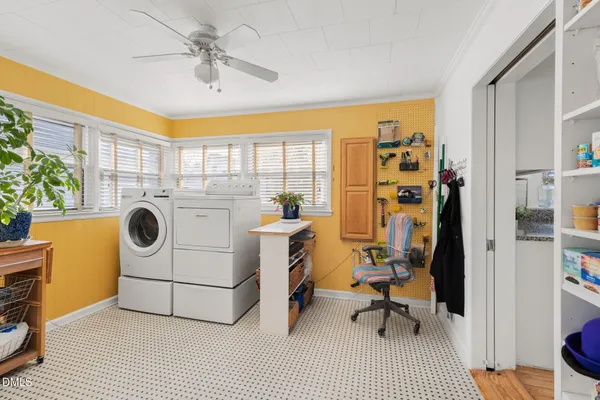 a view of a workspace with furniture and a kitchen