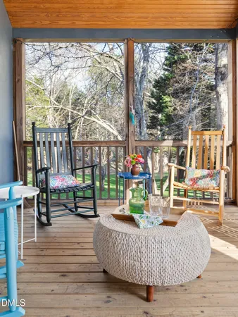 a backyard of a house with yard and outdoor seating