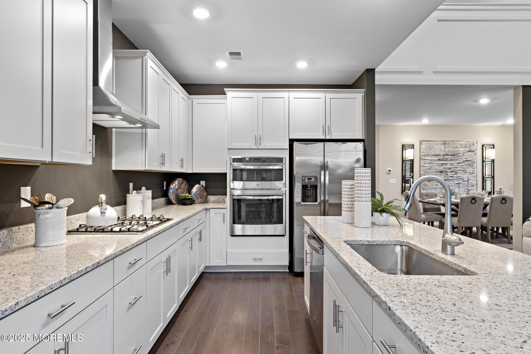 1 Canterbury Road New Egypt, NJ 08533 - Photo 16 of 40 a kitchen with stainless steel appliances granite countertop a sink a stove and cabinets