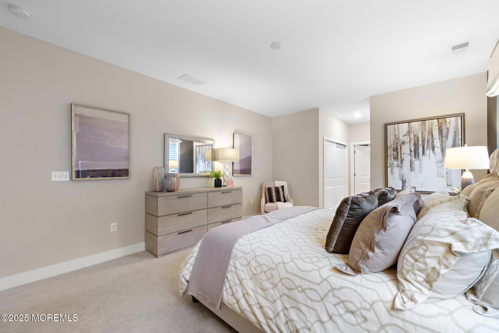 1 Canterbury Road New Egypt, NJ 08533 - Photo 18 of 40 a bedroom with a bed and a couch