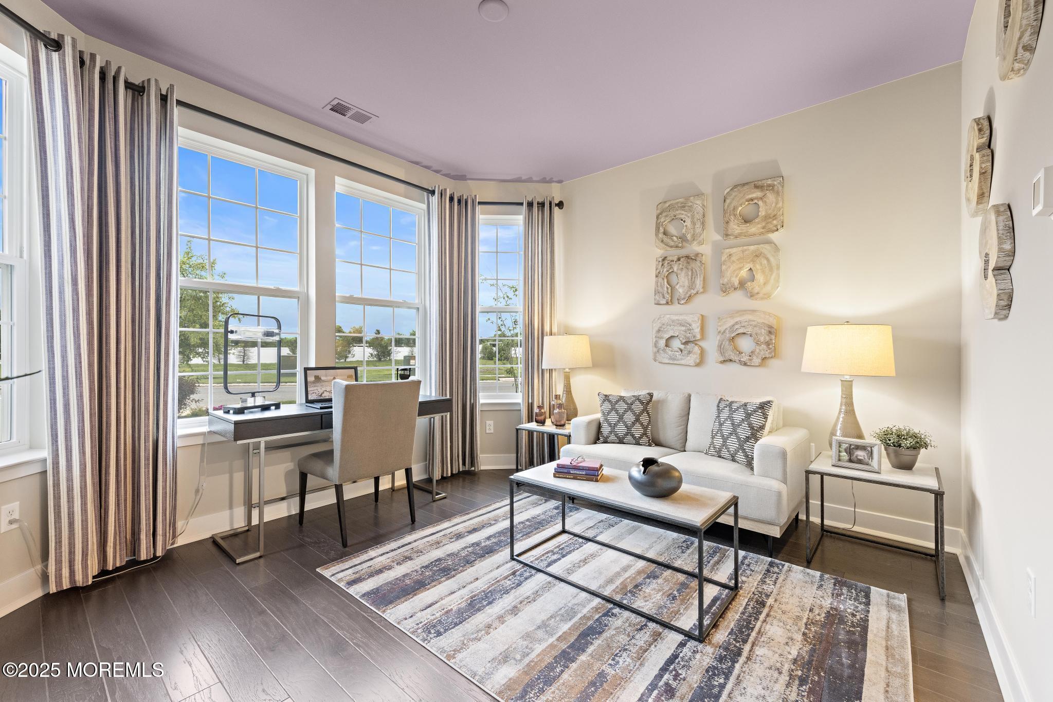 1 Canterbury Road New Egypt, NJ 08533 - Photo 22 of 40 a living room with furniture a wooden floor and a large window